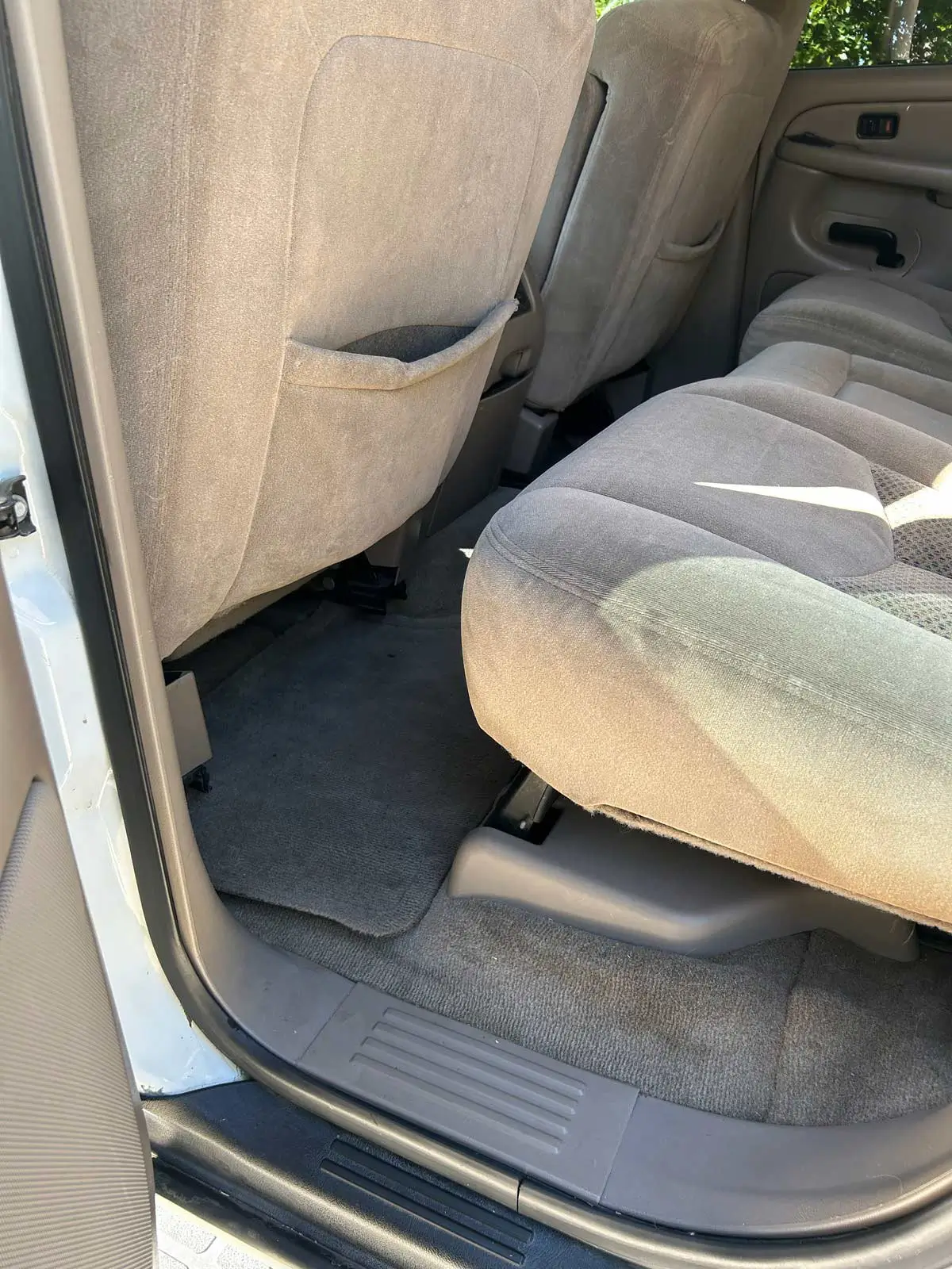 Close-up of a freshly detailed vehicle interior console and cup holders