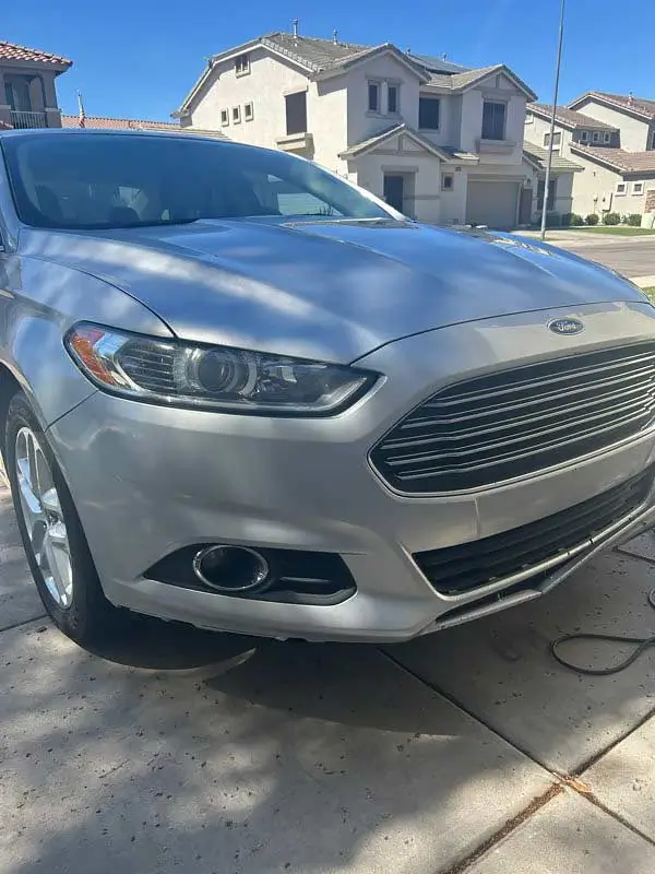 Freshly detailed silver Ford Fusion exterior, front three-quarter view