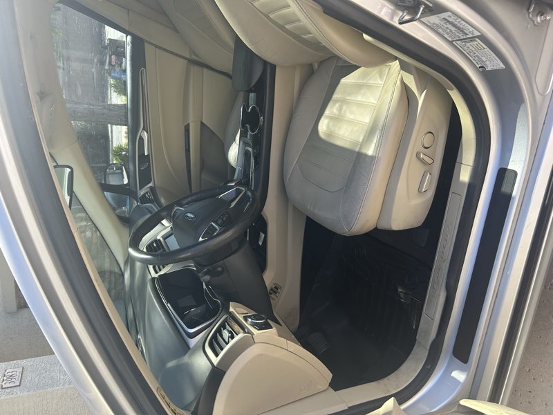 Clean Ford Fusion front seats and dashboard interior