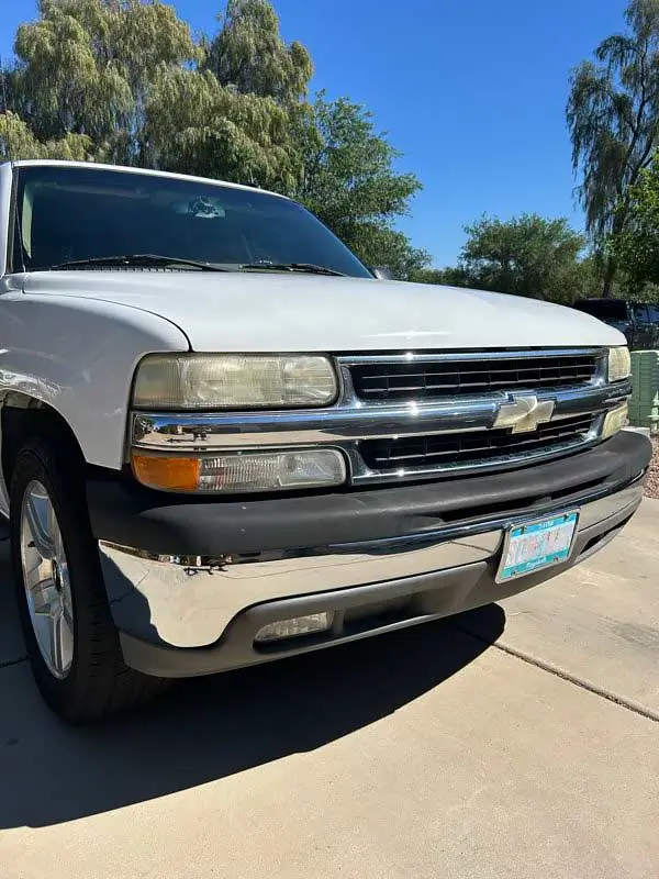 Freshly detailed white Chevy Tahoe exterior, front three-quarter view