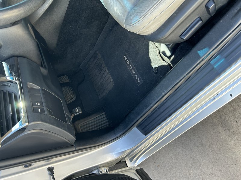 Clean pickup truck driver footwell and floor mat interior